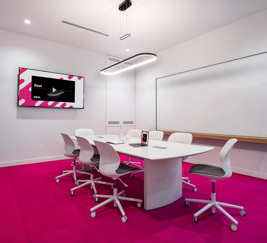 Boardroom interior with presentation display and whiteboard